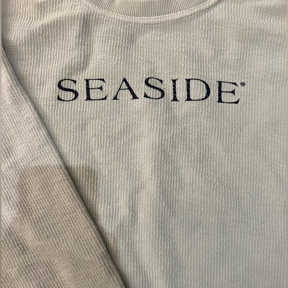 Seaside ribbed sweatshirt. size adult XS. light teal with navy font.